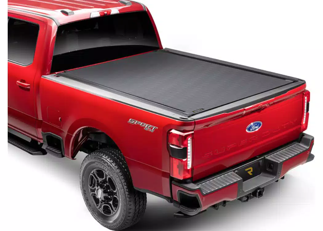 f2f303b85d90e8e978b40e818a247305 RealTruck Bak Revolver X4s Hard Roll Up Tonneau Cover (80330) for 2017-2025 Powerstroke 6.7L 6'9" Bed - Image 1