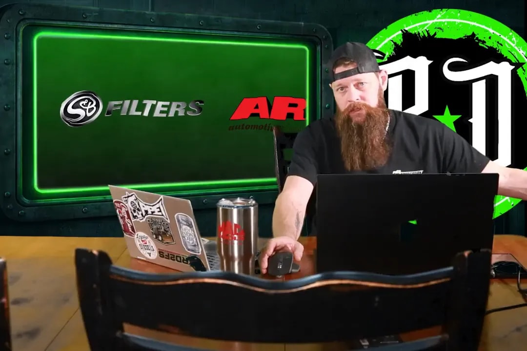 Host at desk with 'Filters' and ARP logos visible on the presentation screen